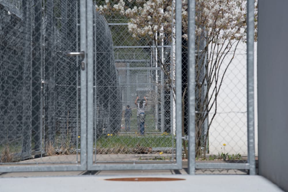 Refugee or asylum seeker in immigration detention prior to hearing
